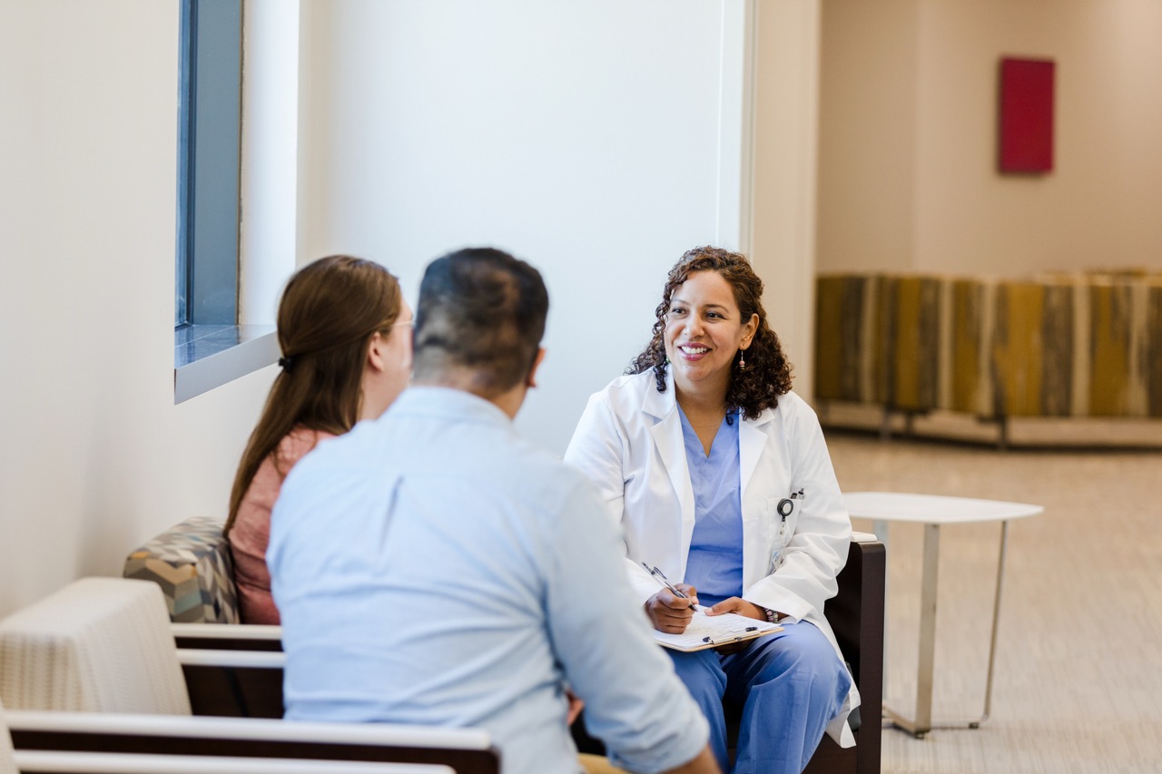 Patients meet with a physician in a sitting area of an ASC.